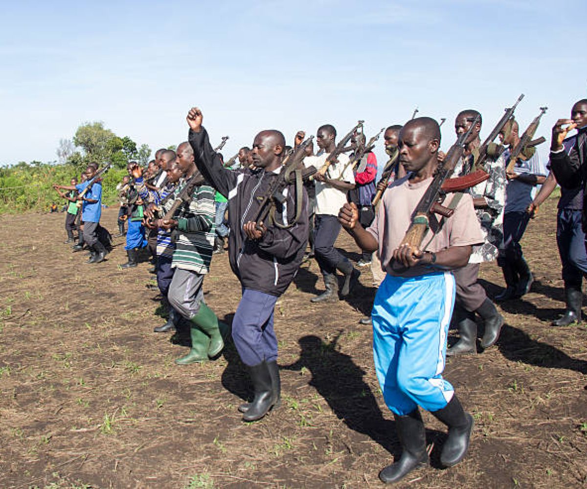 Chai, North Kivu, DRC - March 29, 2014: FDLR soldiers marching and training on an abandon football field before patrols.