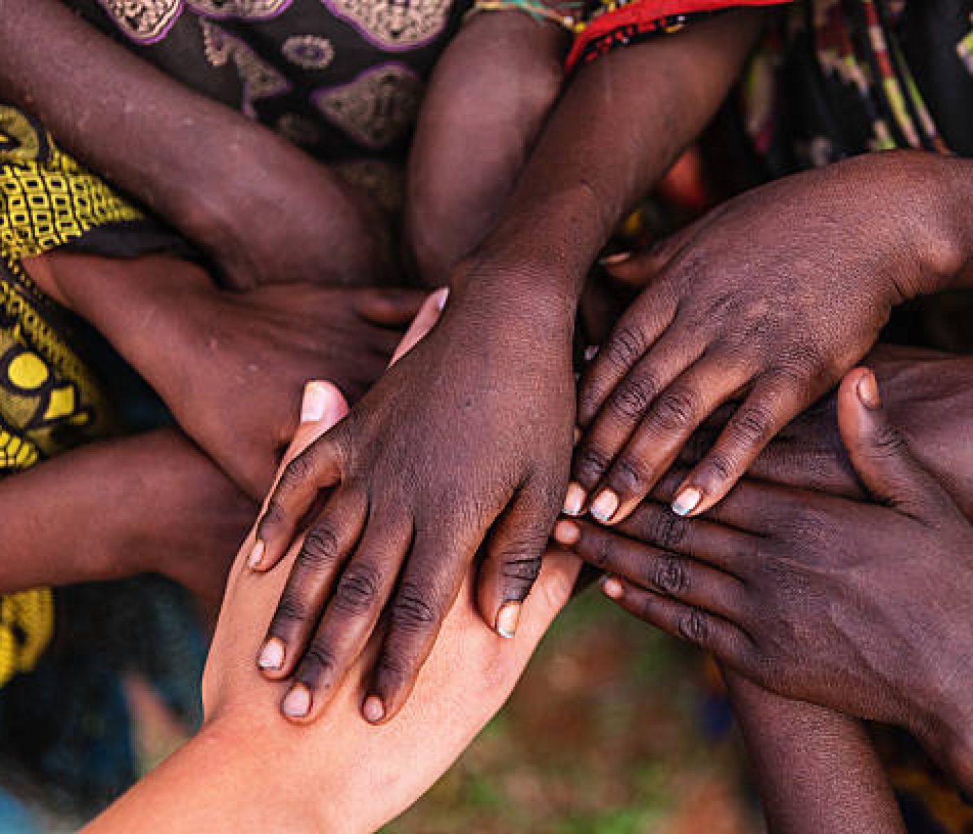 "Multiracial human hands in one of African villages, Ethiopia, East Africa"